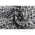 Tela jacquard con estampado de leopardo en blanco y negro